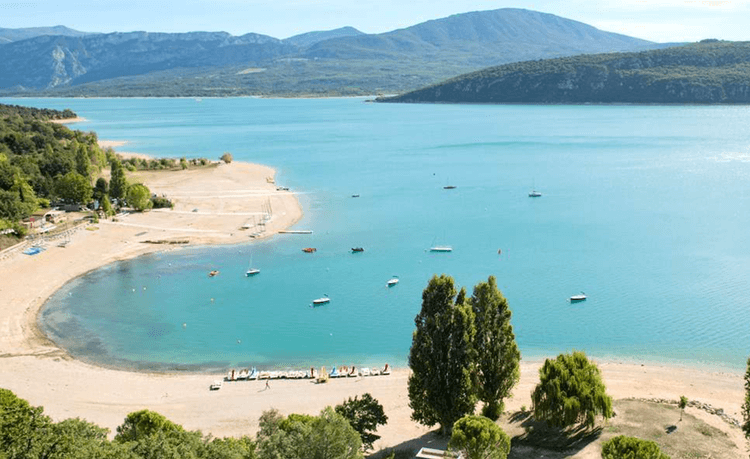 A beach next to a beautiful coastline
